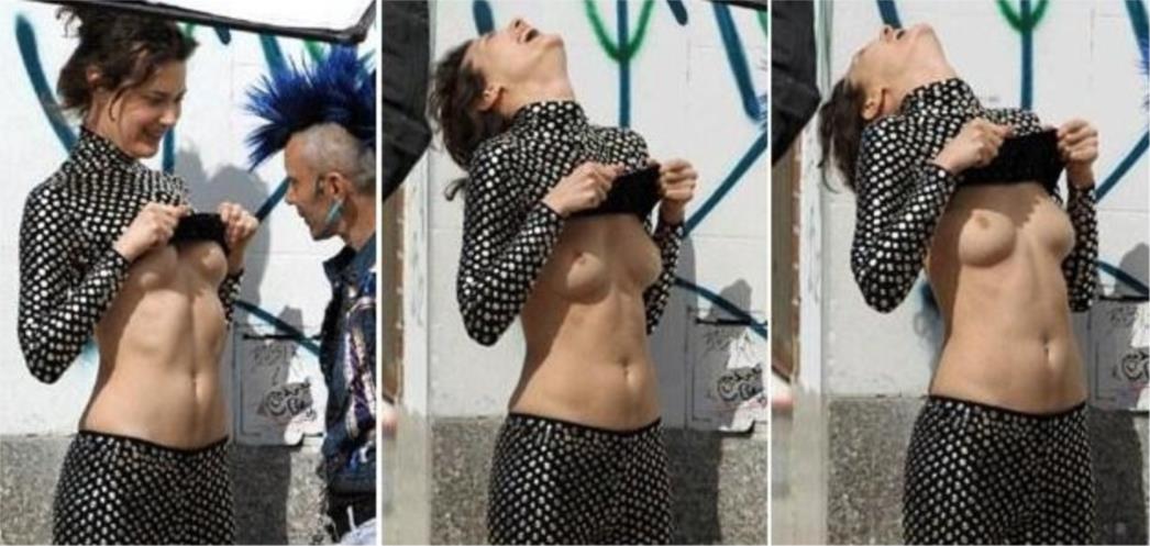 Manekenka Shalom Harlow usred fotografiranja digla majicu i pokazala gole grudi